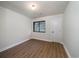 Bright bedroom with hard flooring and a window, offering a clean and minimalist space at 103 Four Iron Dr, Summerville, SC 29483