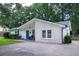 Inviting home exterior with a vibrant blue front door and a well-kept lawn at 103 Four Iron Dr, Summerville, SC 29483