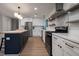 Open kitchen with a butcher block island, stainless steel appliances, and white cabinets at 103 Four Iron Dr, Summerville, SC 29483