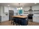 Bright kitchen features white cabinets, stainless steel appliances, and a butcher block island with seating at 103 Four Iron Dr, Summerville, SC 29483