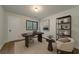 Bright home office features a sleek desk, comfortable chair, stylish shelving unit, and natural light at 103 Four Iron Dr, Summerville, SC 29483