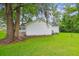 View of rear of house from lush green backyard at 106 N Pine St, Summerville, SC 29483