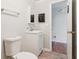 Bathroom featuring tile floors, toilet, sink, mirror and vanity at 106 N Pine St, Summerville, SC 29483