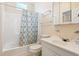 Bathroom with a tub, shower, and patterned shower curtain at 106 N Pine St, Summerville, SC 29483