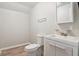Bathroom featuring tile floors, toilet, sink, mirror and vanity at 106 N Pine St, Summerville, SC 29483