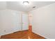 Bedroom featuring hardwood floors, closet, and light colored walls at 106 N Pine St, Summerville, SC 29483