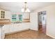Traditional kitchen with white cabinets, ample countertop space, and classic lighting at 106 N Pine St, Summerville, SC 29483