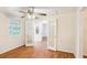 The living room has hardwood floors, lots of natural light, and access to the front door at 106 N Pine St, Summerville, SC 29483