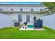 Well-maintained backyard featuring a grill, patio, and privacy fence at 108 Hemingway Cir, Summerville, SC 29483