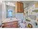 Bright bathroom with a single sink vanity, decorative shower curtain, and a neutral color palette at 108 Hemingway Cir, Summerville, SC 29483
