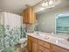 Full bathroom features double sink vanity and shower with floral curtain at 108 Hemingway Cir, Summerville, SC 29483