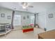 Charming bedroom with neutral carpet, two windows, a ceiling fan, and playful decor at 108 Hemingway Cir, Summerville, SC 29483