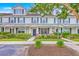 Attractive townhome showcasing a well-maintained lawn, inviting entrance, and classic design elements at 108 Hemingway Cir, Summerville, SC 29483