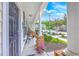 Inviting front porch with decorative columns, potted plants, and comfortable seating, perfect for relaxation at 108 Hemingway Cir, Summerville, SC 29483