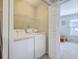 Functional laundry room with a washer, dryer, and shelving for storage at 108 Hemingway Cir, Summerville, SC 29483