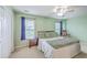 Bright main bedroom with carpet floors, ceiling fan, and two windows at 108 Hemingway Cir, Summerville, SC 29483