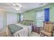 Bright main bedroom with carpet floors, ceiling fan, and two windows at 108 Hemingway Cir, Summerville, SC 29483