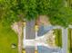 An overhead aerial shot of two similar homes featuring dark shingles, and stained porches with lush trees surrounding at 108 Swanson Dr, Summerville, SC 29483
