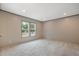 Bright bedroom featuring neutral walls, plush carpeting, and natural light streaming through double windows at 108 Swanson Dr, Summerville, SC 29483