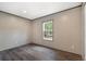 A modern bedroom offers stylish dark wood flooring, and a sun-lit window at 108 Swanson Dr, Summerville, SC 29483