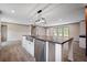 Open-concept kitchen featuring a large island with stainless steel appliances and a farmhouse sink at 108 Swanson Dr, Summerville, SC 29483