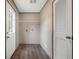 Convenient laundry room featuring a door to outside, storage shelf, and light hardwood style floors at 108 Swanson Dr, Summerville, SC 29483