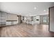 Open-concept living area with hardwood floors connecting the kitchen and dining spaces at 108 Swanson Dr, Summerville, SC 29483