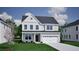 Charming two-story home with gray siding, a two-car garage, and a well-manicured lawn at 111 Crosscut Ln, Summerville, SC 29486