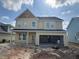 New construction home featuring a spacious two-car garage awaiting completion at 111 Crosscut Ln, Summerville, SC 29486