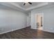 A spacious bedroom with luxury vinyl plank flooring, and a view into the attached bathroom at 116 Crosscut Ln, Summerville, SC 29486