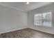 Cozy bedroom with hardwood floors and a large window with blinds at 116 Crosscut Ln, Summerville, SC 29486