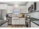 Contemporary kitchen featuring white cabinets, stainless steel appliances, and tile backsplash at 116 Crosscut Ln, Summerville, SC 29486