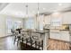 Bright, modern kitchen with granite countertops, island, and stainless steel appliances at 116 Crosscut Ln, Summerville, SC 29486