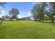 Expansive backyard with lush green lawn, above ground pool, and room for outdoor activities and recreation at 117 Ponderosa Rd, Summerville, SC 29483