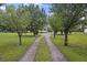 Gravel driveway leading to a home and partially obscured by trees at 117 Ponderosa Rd, Summerville, SC 29483