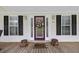Close up of front door, complete with a flower wreath and decorative buckets at 117 Ponderosa Rd, Summerville, SC 29483