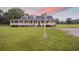 Charming exterior of home with white pillars, covered porch, and well-maintained lawn at dusk at 117 Ponderosa Rd, Summerville, SC 29483