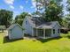 Aerial view of the home's backyard showing the well-manicured lawn, and separate outbuilding at 125 Ridge Rd, Summerville, SC 29485