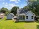 Aerial view of the backyard with lush lawn, detached outbuilding, and covered patio at 125 Ridge Rd, Summerville, SC 29485