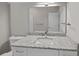 Bathroom vanity featuring a granite countertop, white cabinets, and a sleek faucet at 125 Ridge Rd, Summerville, SC 29485