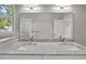 Bathroom featuring double sink vanity with granite countertop and large mirror at 125 Ridge Rd, Summerville, SC 29485