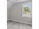 Comfortable bedroom features light gray walls, gray flooring and a sunny window view at 125 Ridge Rd, Summerville, SC 29485