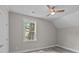 Bright bedroom with a ceiling fan, and a large window providing a scenic view at 125 Ridge Rd, Summerville, SC 29485