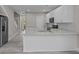 Modern kitchen with white cabinets, granite counters, and stainless steel appliances at 125 Ridge Rd, Summerville, SC 29485