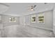 Spacious living room with new flooring, abundant natural light, and a ceiling fan at 125 Ridge Rd, Summerville, SC 29485