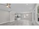 Bright, open living room with recessed lights, ceiling fan, and views of the kitchen at 125 Ridge Rd, Summerville, SC 29485