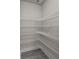 Spacious walk-in pantry featuring white wire shelving and light gray flooring at 125 Ridge Rd, Summerville, SC 29485