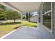 Covered patio with a view of the yard and surrounding greenery at 125 Ridge Rd, Summerville, SC 29485