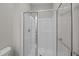Bathroom shower with clear glass door and walls of white tile at 125 Ridge Rd, Summerville, SC 29485