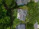 Aerial view of a home with a backyard patio, enclosed fence, and mature trees for privacy at 1250 White Tail Path, Charleston, SC 29414